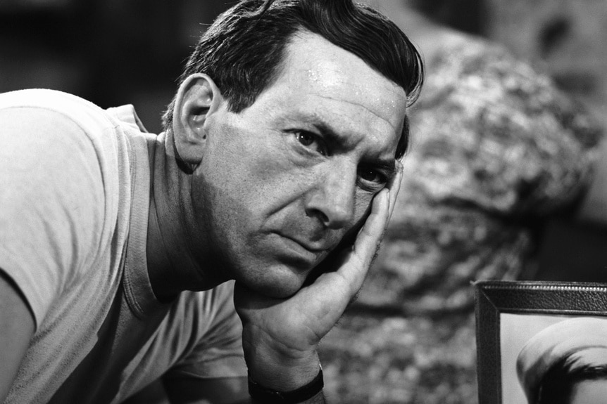 Jack Klugman rests his head on his hand in The Twilight Zone.