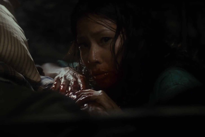 A bloody Sadie Blake (Lucy Liu) feeds on a victim in Rise: Blood Hunter (2007).