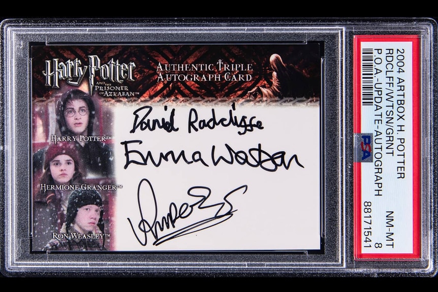 A Harry Potter Trading Card with signatures from Daniel Radcliffe, Emma Watson, and Rupert Grint.