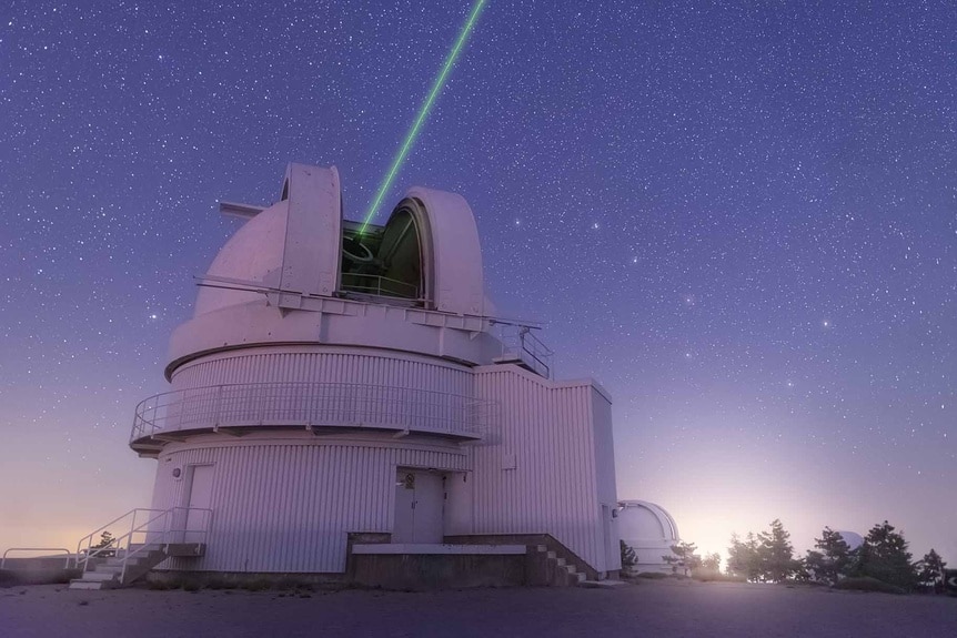 A telescope calibrates with a laser