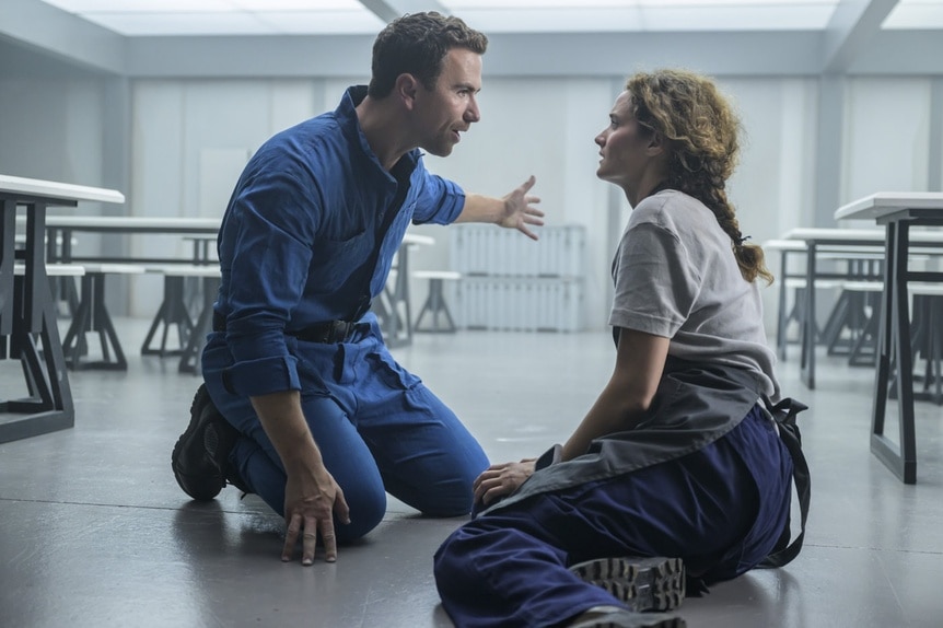 Lt. James Brice (Richard Fleeshman) speaks to Lt. Sharon Garnet (Christie Burke) on the floor on The Ark Episode 204.