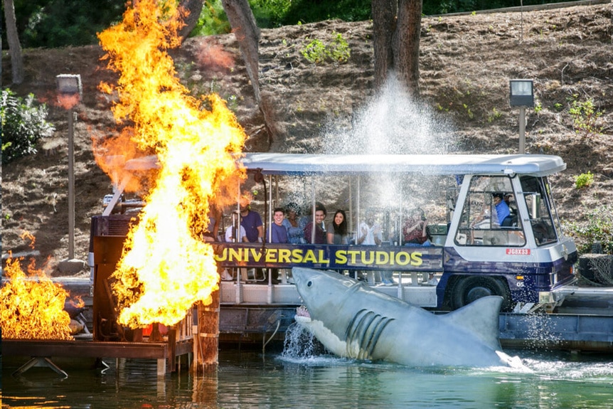 A shark and fire appear at Universal Studios Hollywood's Jaws Lake ride.