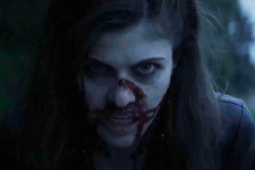 Alexis Butler (Alexandra Daddario) is bloody and angry in We Summon The Darkness (2019).