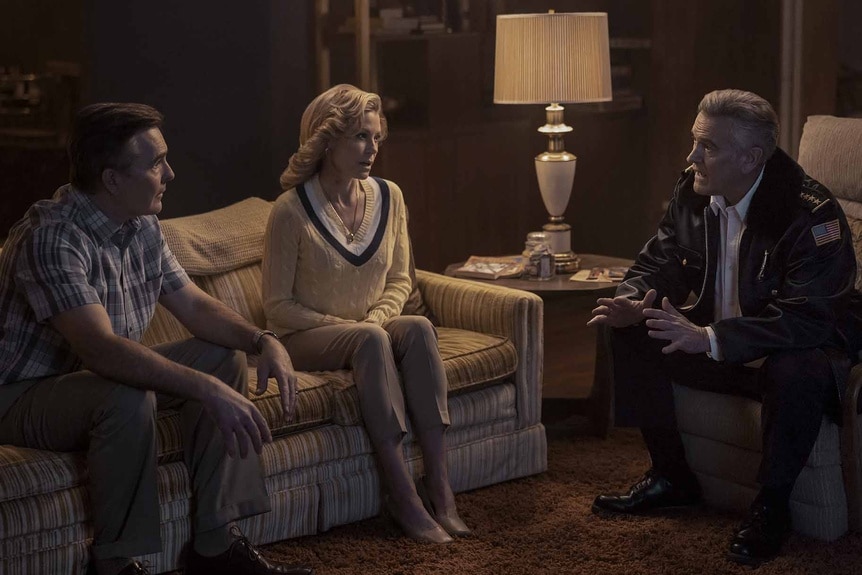 Gene (Nolan North), Linda (Julie Bowen), and Chief Dandridge (Bruce Campbell) talk on a couch on Hysteria! Episode 105.