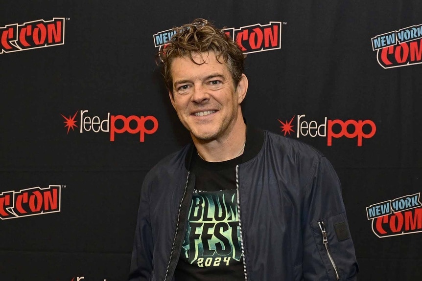 Jason Blum smiles at New York Comic Con 2024.