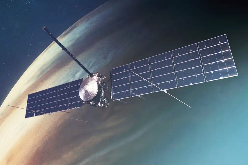 An illustration of NASA’s Europa Clipper spacecraft with solar arrays fully deployed in orbit around Jupiter.