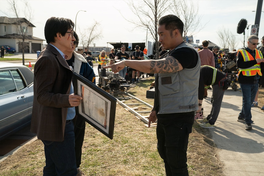 Ke Huy Quan (as Marvin Gable) and director Jonathan Eusebio on the set of Love Hurts.