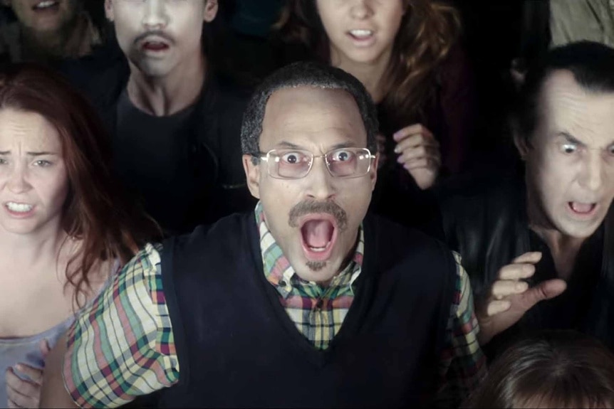 Mr. Keller (Keegan-Michael Key) looks appalled in a crowd in Freaks of Nature (2015).