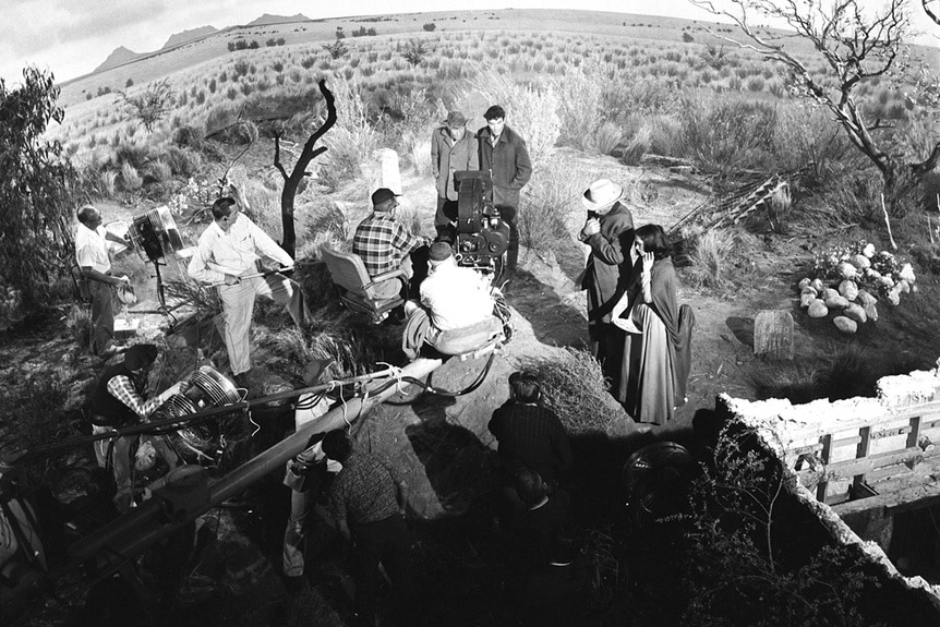 A camera crew shooting an episode of The Twilight Zone at a gravesite.